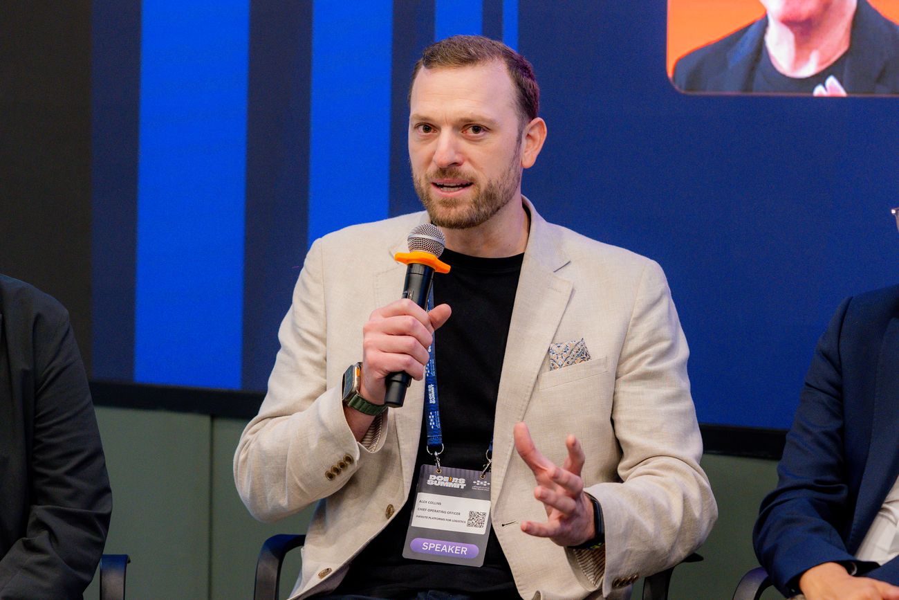 Alex Collins speaking at the Doers Summit in Dubai
